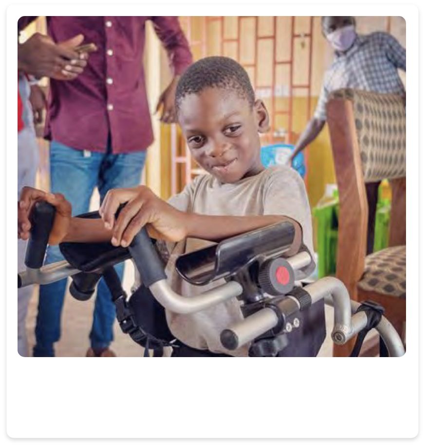 Image shows a child with a walking aid