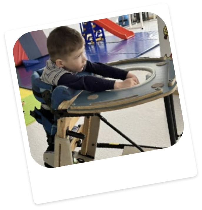 Child using a standing and walking aid